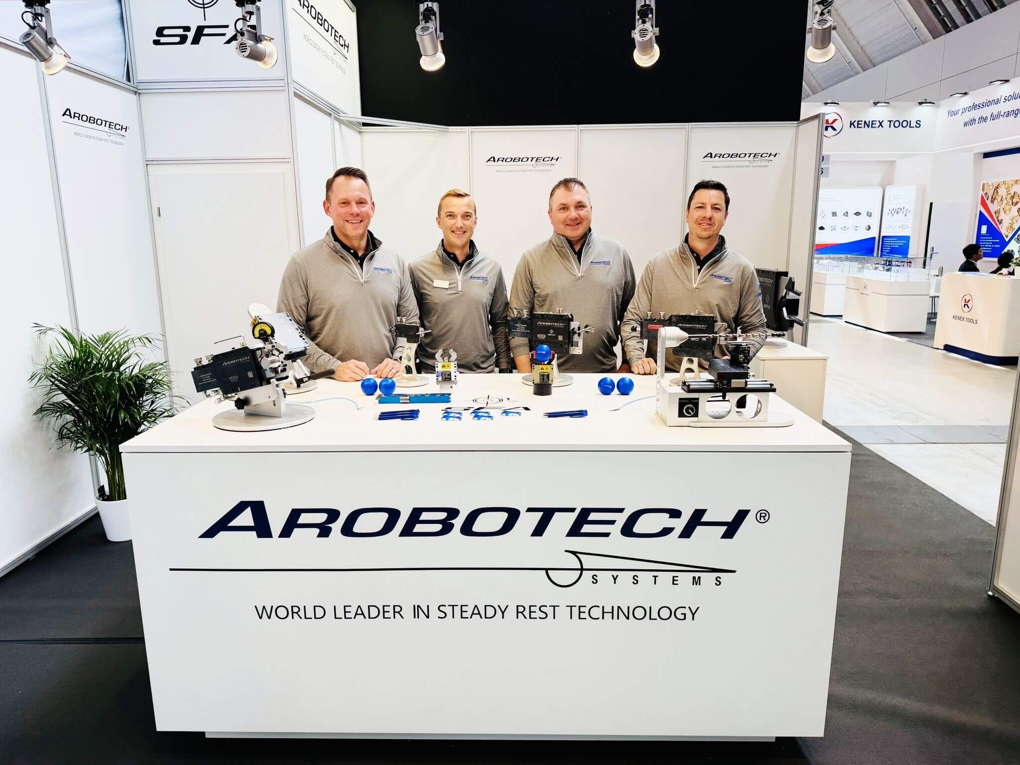 People standing at Aerobotech booth at Grinding Hub 2026
